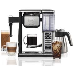 A coffee maker with a cup of coffee and a cup of iced coffee, comparing Ninja Coffee Bar and Keurig.