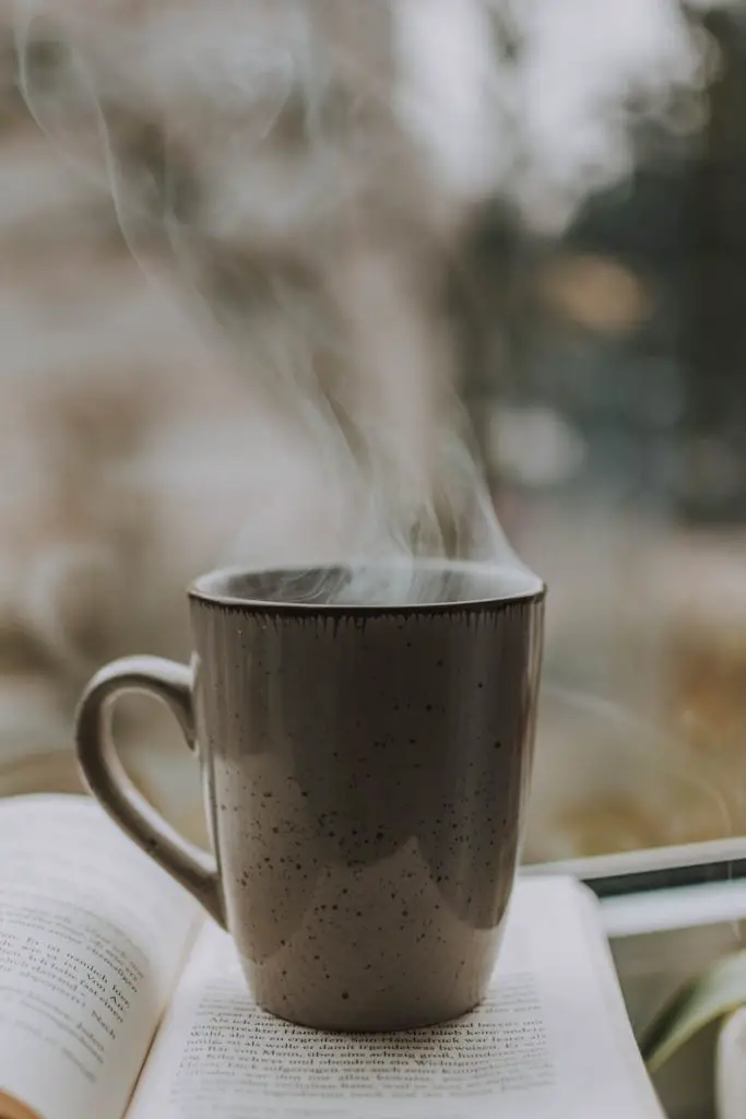 freshly brewed coffee on a book