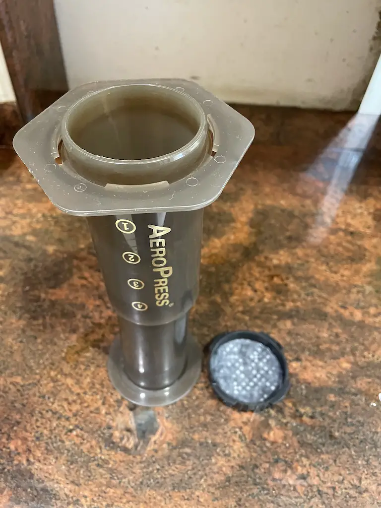 prep the aeropress by inverting it and wetting the filter