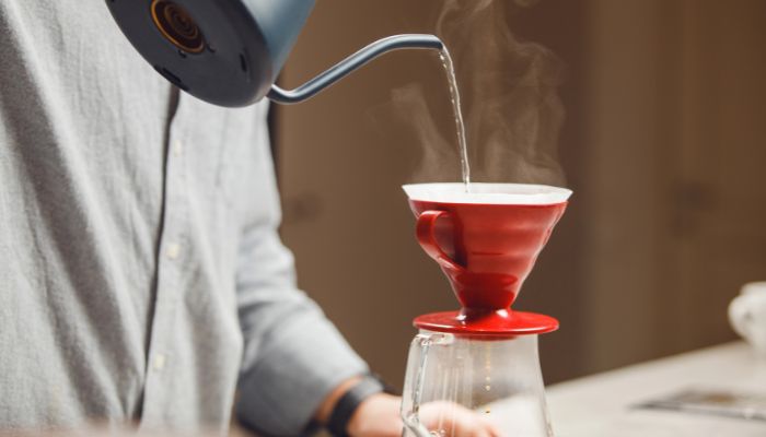 Best water for coffee: pouring from a gooseneck kettle into a pour-over dripper